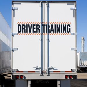 Truck with the words "Driver Training" on the back. 