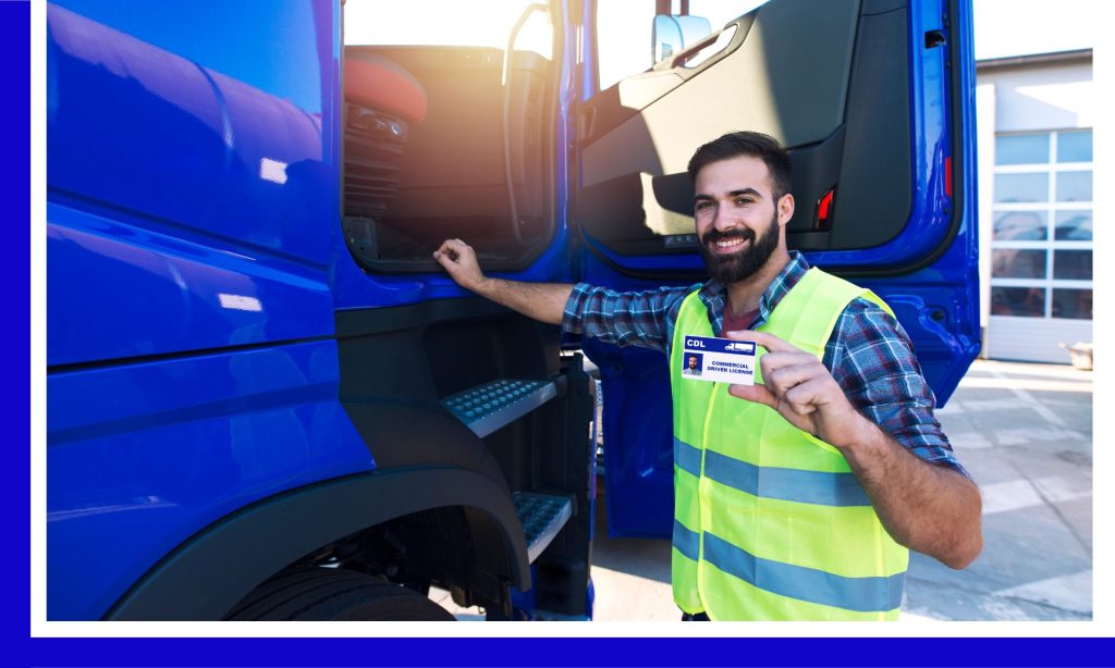 Truck driver posing with a CDL alongside a semi truck